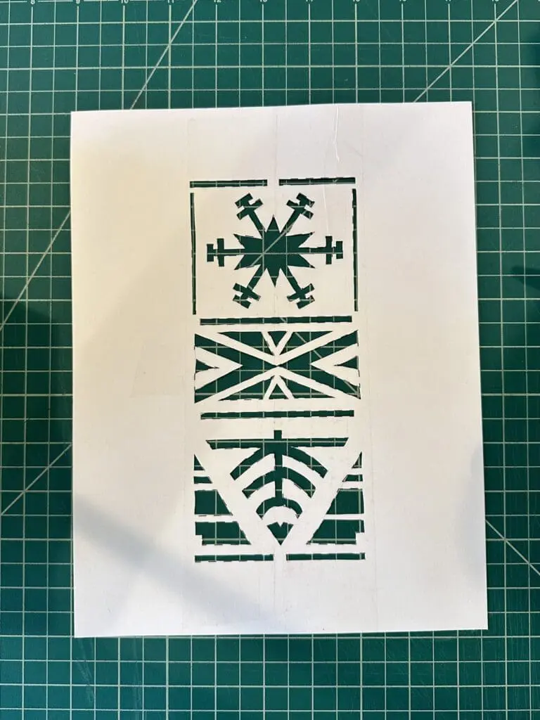 paper stencil with a nordic winter pattern