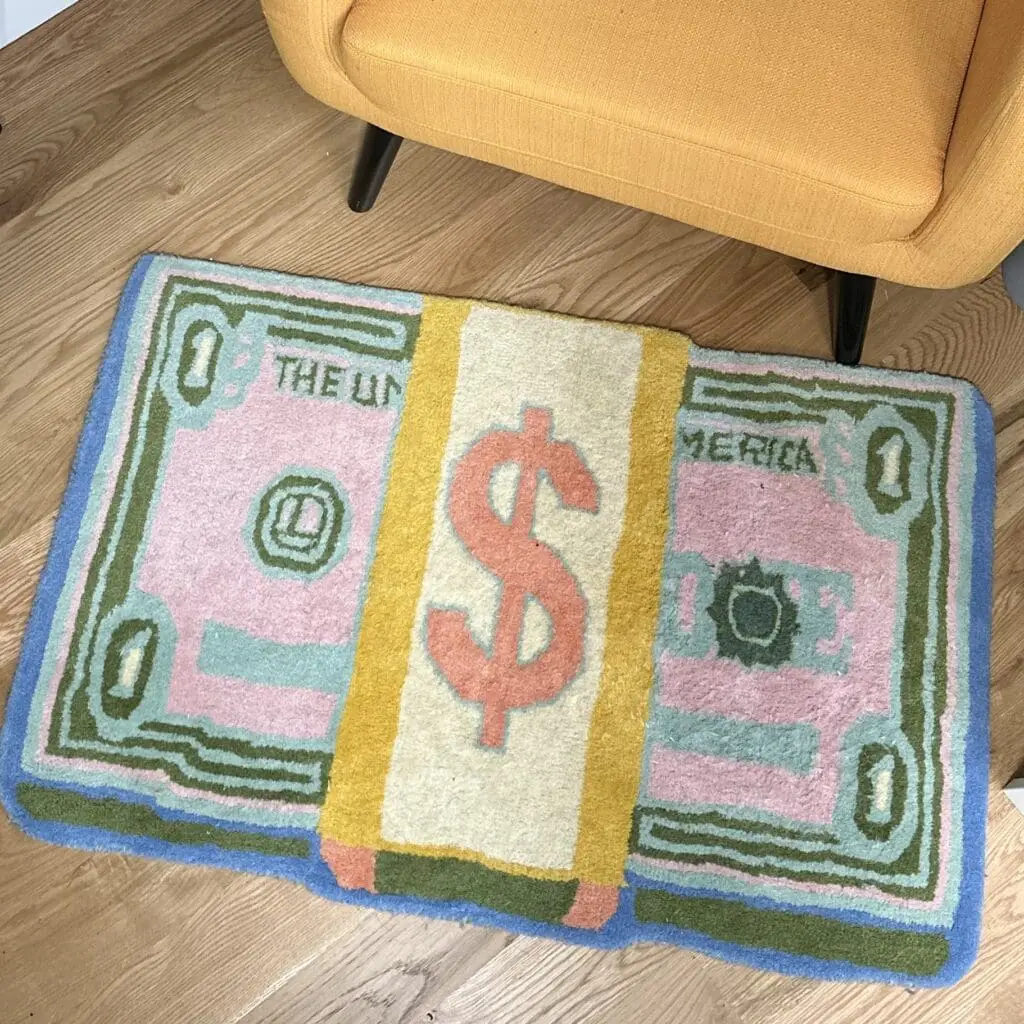 A rug that looks like a stack of money